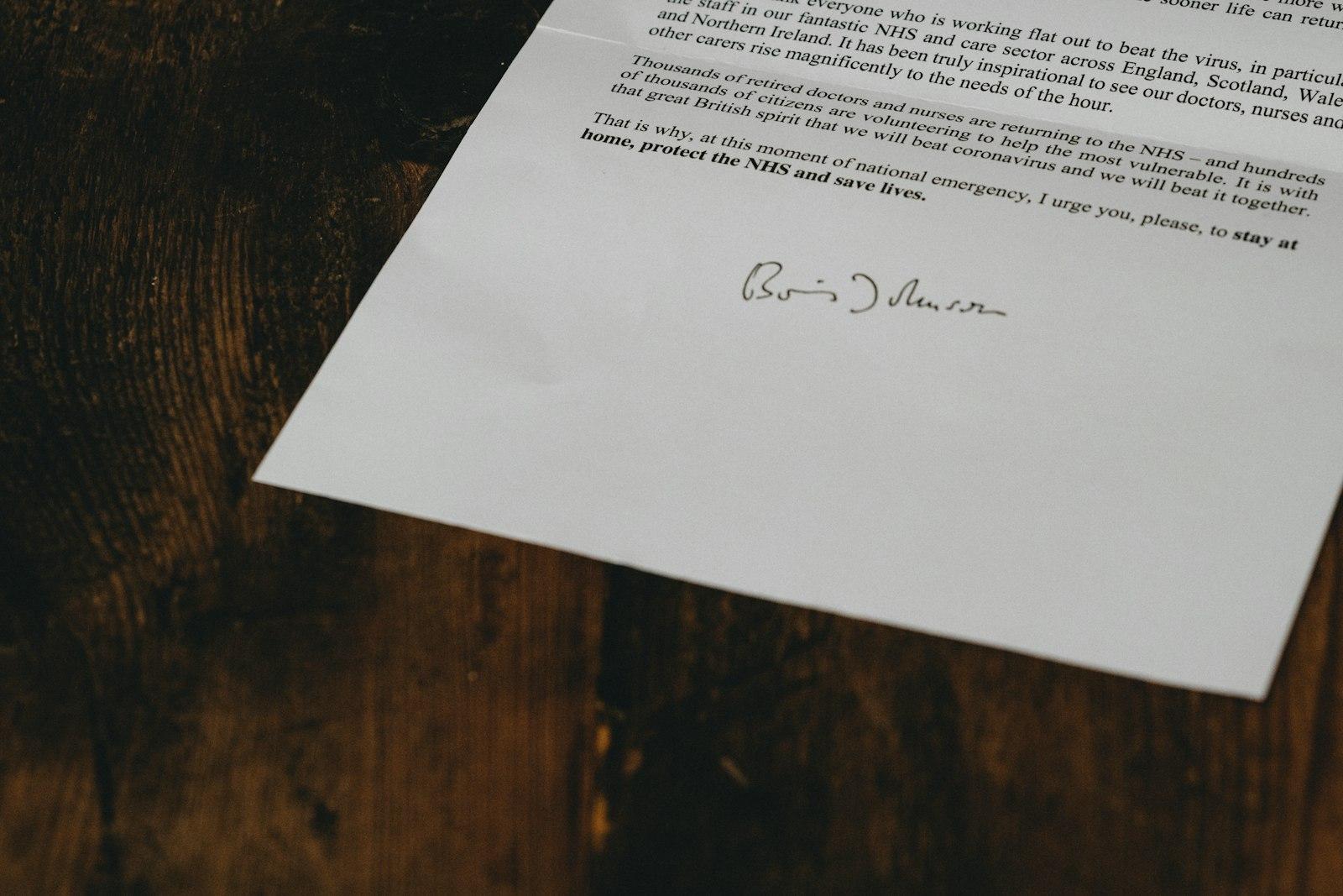 White printer paper on brown wooden table